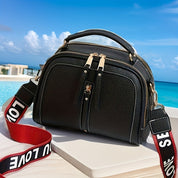 Eva | Kompakte Schultertasche mit Kontrastdetails