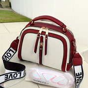 Eva | Kompakte Schultertasche mit Kontrastdetails